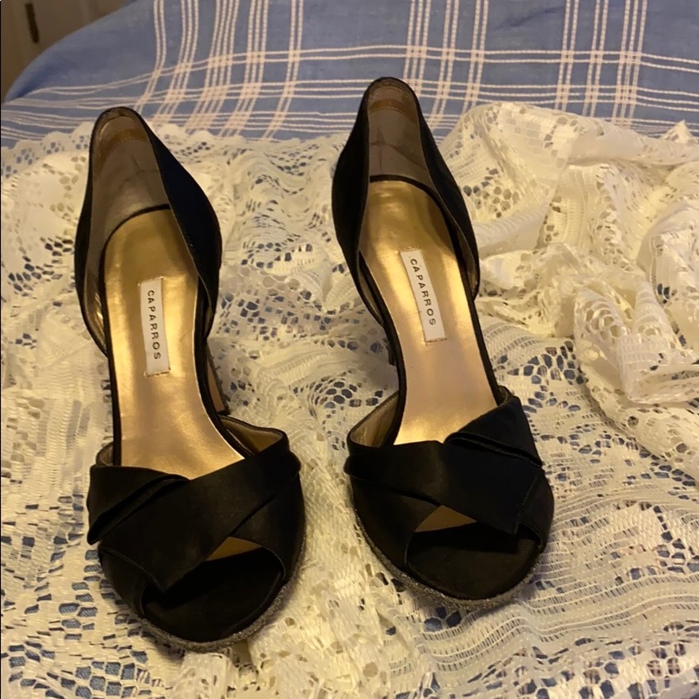 Women’s black and silver glitter high heels.